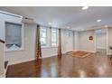 Bright and airy living room with hardwood floors and large windows at 174 Rivertown Rd, Fairburn, GA 30213
