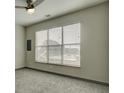 Bedroom with neutral carpet, a ceiling fan, and a large window with blinds at 238 Walker Sw St # 32, Atlanta, GA 30313