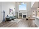 Bright open living room with soaring ceilings, fireplace and large windows at 3735 Turnbury Oaks Dr, Peachtree Corners, GA 30096