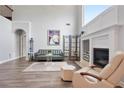 Bright open living room with soaring ceilings, fireplace and large windows at 3735 Turnbury Oaks Dr, Peachtree Corners, GA 30096