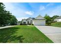 Charming two-story home featuring a well-manicured lawn and a convenient two-car garage at 3047 Standing Rock Ct, Lithia Springs, GA 30122