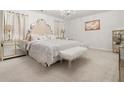 Luxurious bedroom featuring plush carpeting, a chandelier, and sophisticated furnishings at 108 Berwick Crossing, Dallas, GA 30157