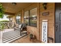 Inviting front porch with seating and decor, offering a cozy and welcoming entrance to the home at 490 Hunters Glen Ct, Lawrenceville, GA 30044
