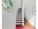 Inviting entryway with a staircase, hardwood floors, and neutral decor creates a warm welcome at 1346 Peter Haughton Nw Way # 2, Atlanta, GA 30318