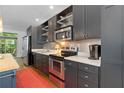 Well-equipped kitchen features modern appliances, sleek countertops, and ample storage space at 1346 Peter Haughton Nw Way # 2, Atlanta, GA 30318