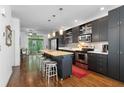 Modern kitchen featuring stainless steel appliances, stylish cabinets, and a central island at 1346 Peter Haughton Nw Way # 2, Atlanta, GA 30318