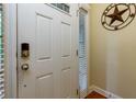 Welcoming entryway featuring a secure white door, and a decorative welcome sign at 2107 Se Gorman Se Grv # 132, Atlanta, GA 30316