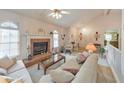 Cozy living room with brick fireplace and lots of natural light at 4260 Keheley Lake Ne Dr, Marietta, GA 30066
