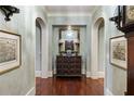 Charming hallway with arched doorways, framed artwork, and decorative table at 1 Brookhaven Ne Dr # 205, Atlanta, GA 30319