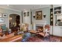 Cozy living room with fireplace, custom shelving, and comfortable seating at 1 Brookhaven Ne Dr # 205, Atlanta, GA 30319