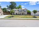 Charming two-story home features manicured lawn and attractive brick and siding exterior at 1620 Brook Ivy Dr, Lawrenceville, GA 30044