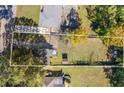 Wide lot exhibiting an expansive driveway, lush lawn, and a storage structure at 2776 Grand Ave, Atlanta, GA 30315