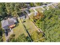 Large lot showcasing the home, driveway, and spacious yard with mature trees at 2776 Grand Ave, Atlanta, GA 30315