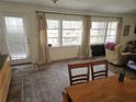 Sunlit living room with large windows, wood floors, area rug, and cozy furniture, creating a welcoming atmosphere at 5440 Portside Dr, Acworth, GA 30101