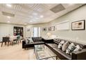 Stylish living room features light walls, leather sofas, and unique ceiling design at 8531 Lake Dr, Snellville, GA 30039