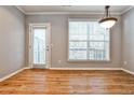 Dining area with hardwood floors and a large window providing natural light at 1126 Village Ct, Atlanta, GA 30316