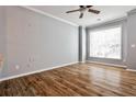 Neutral room with hardwood floors, a ceiling fan, and a large window with blinds at 1126 Village Ct, Atlanta, GA 30316