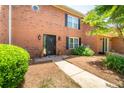 Charming two-story brick home with a well-manicured front yard, black shutters, and a welcoming front door at 3677 Blackshear Ct, Duluth, GA 30096