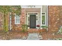 Charming brick and siding home with a well-maintained front yard and welcoming entrance at 171 Riverview Trl, Roswell, GA 30075