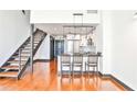Open kitchen with a breakfast bar, stainless steel appliances, and modern lighting at 1261 Caroline St # 211, Atlanta, GA 30307