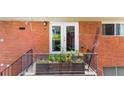 Cozy balcony with seating, greenery and red brick building at 1822 N Rock Springs Ne Rd # 24, Atlanta, GA 30324