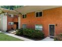 A red brick apartment building featuring well-maintained landscaping and a private entrance at 1822 N Rock Springs Ne Rd # 24, Atlanta, GA 30324