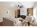 Cozy living room with a modern fireplace and a stylish ceiling fan, creating a warm and inviting atmosphere at 2191 Essex Sw Ave, Atlanta, GA 30311
