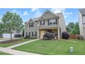 Attractive two-story home with a well-maintained lawn, complemented by lush landscaping at 236 Creek View Ln, Acworth, GA 30102