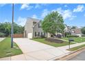 Two-story home with a well-manicured lawn, long driveway, and inviting curb appeal at 236 Creek View Ln, Acworth, GA 30102