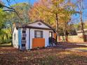 Cozy home featuring distinctive exterior design elements and a well-maintained lawn at 2977 5Th St, Atlanta, GA 30315