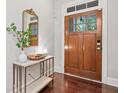 Elegant foyer featuring a wood door, console table, and a decorative mirror at 2801 Avington Se Ln, Smyrna, GA 30080