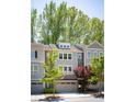 Charming townhomes with a mix of brick and siding exteriors, each featuring an attached garage at 2813 White Oak Ln, Decatur, GA 30032