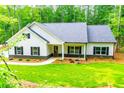 Attractive single-Gathering home with white siding, black shutters, and well-maintained lawn and landscaping at 5525 Belle Meade Dr, Villa Rica, GA 30180