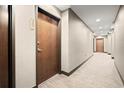 Hallway with carpet flooring and neutral-colored walls and doors at 855 Peachtree Ne St # 2205, Atlanta, GA 30308