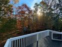 Backyard view from the porch shows a peaceful and tree-filled landscape, providing a serene, natural outlook at 3337 Camens Way, Buford, GA 30519