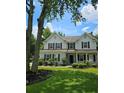Traditional two-story home featuring a well-maintained lawn and classic black shutters at 4845 Weathervane Dr, Alpharetta, GA 30022