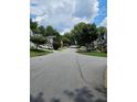 A quiet suburban street with well-kept lawns and various home styles at 4845 Weathervane Dr, Alpharetta, GA 30022