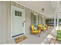 Inviting front porch with seating, a stylish door, and a 'wipe your paws' welcome mat at 1444 Arden Sw Dr, Marietta, GA 30008