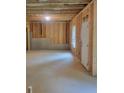 Spacious unfinished basement with wood framing and concrete foundation, providing potential for a customized living area at 558 Fairview Oak Pl, Dallas, GA 30157