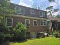 Back of the house shows brick exterior with multiple windows at 1526 Snapfinger Rd, Decatur, GA 30032