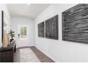 Stylish foyer with modern art, a decorative table, and a view of the front door at 608 Belshire Dr, Acworth, GA 30102