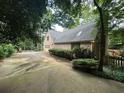 Brick home featuring a private driveway and mature trees at 4116 River Cliff Chase Se, Marietta, GA 30067