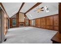 Bright and spacious living room with wood paneling, brick fireplace, and vaulted ceilings at 4116 River Cliff Chase Se, Marietta, GA 30067