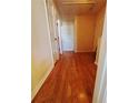 Bright hallway featuring attractive wood flooring and multiple entryways at 2315 Oakland Spring Dr, Snellville, GA 30039