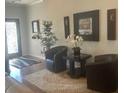 Cozy living room with contemporary decor, stylish seating arrangements, and an inviting ambiance at 3311 Lindenridge Dr, Buford, GA 30519