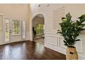 Bright foyer with hardwood floors, white trim, and decorative accents at 4249 Caveat Ct, Fairburn, GA 30213
