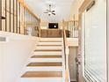 Inviting entryway with wooden staircase and a view of the living room at 275 Cedars, Villa Rica, GA 30180