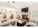 Cozy living room with stone fireplace, vaulted ceiling, and comfortable seating at 275 Cedars, Villa Rica, GA 30180