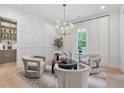 Cozy sitting area with stylish chairs, modern lighting, and a view of the outdoor space at 104 Trinity Hollow Dr, Canton, GA 30115