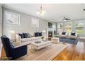 Bright living room featuring a fireplace, hardwood floors, and comfortable seating at 1777 Meadow Sw Ln, Atlanta, GA 30315